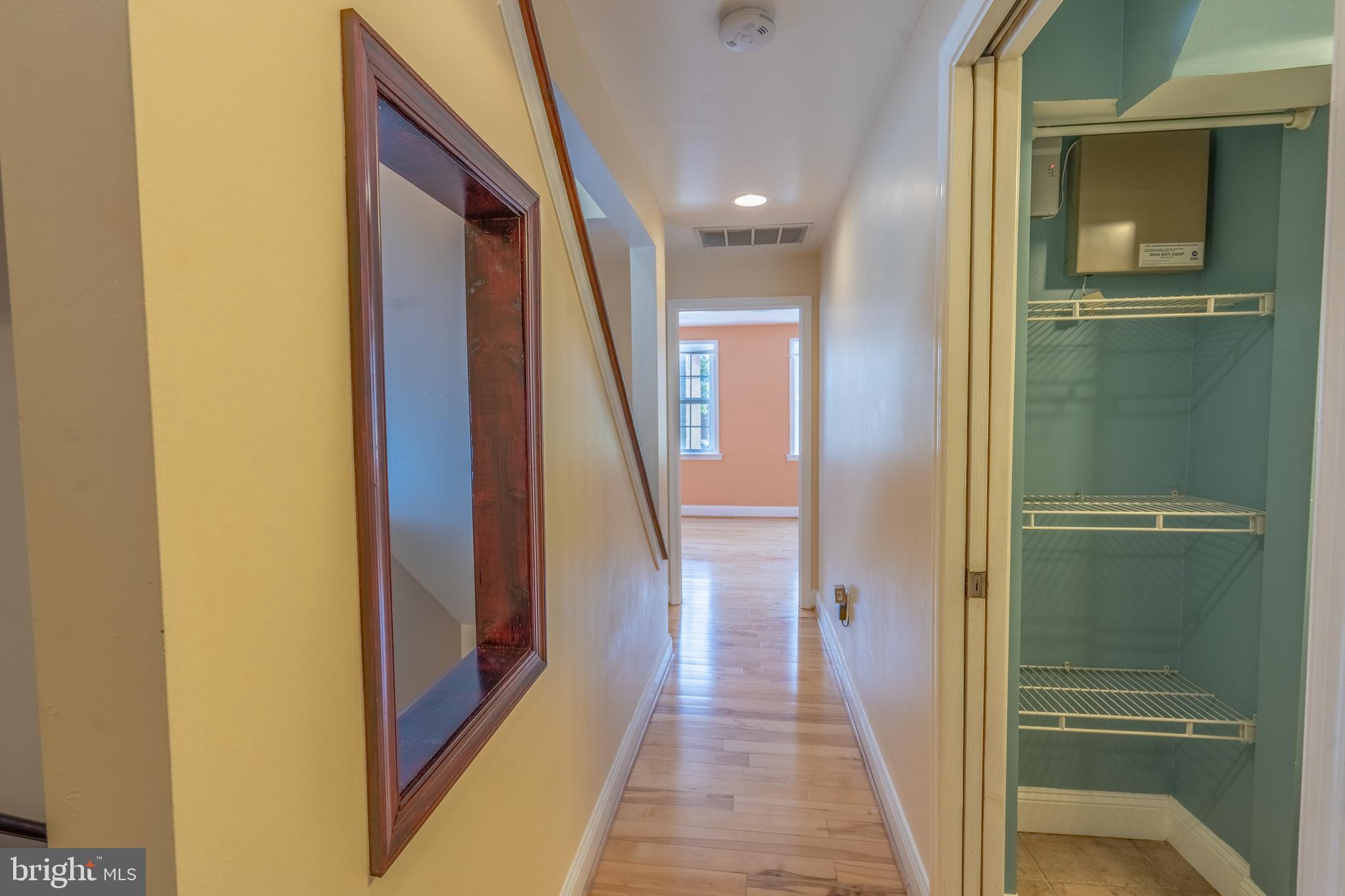 508 Scott Street Baltimore, MD 21230 - Photo 34 of 63 a view of a hallway with wooden floor and staircase