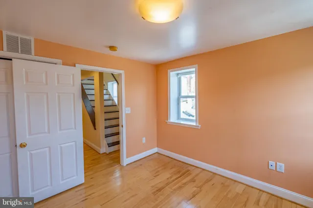 a view of a bathroom with brick walls