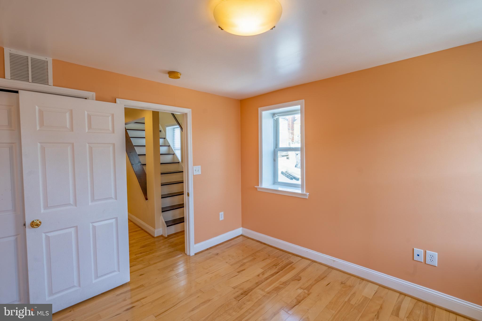 508 Scott Street Baltimore, MD 21230 - Photo 43 of 63 an empty room with wooden floor closet and windows