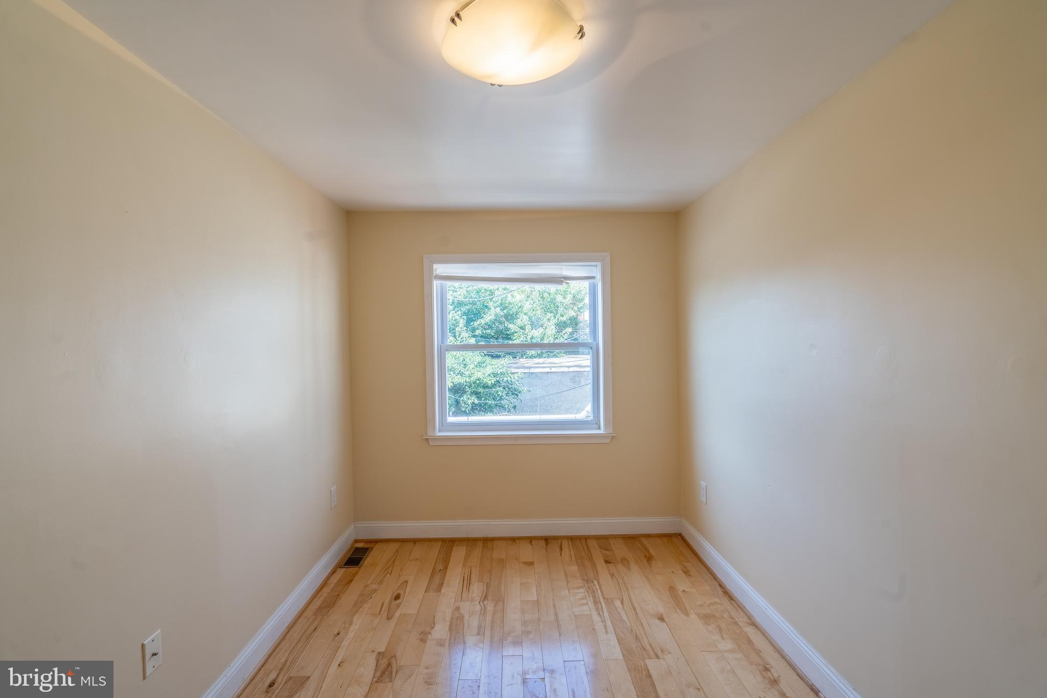 508 Scott Street Baltimore, MD 21230 - Photo 47 of 63 an empty room with wooden floor and windows