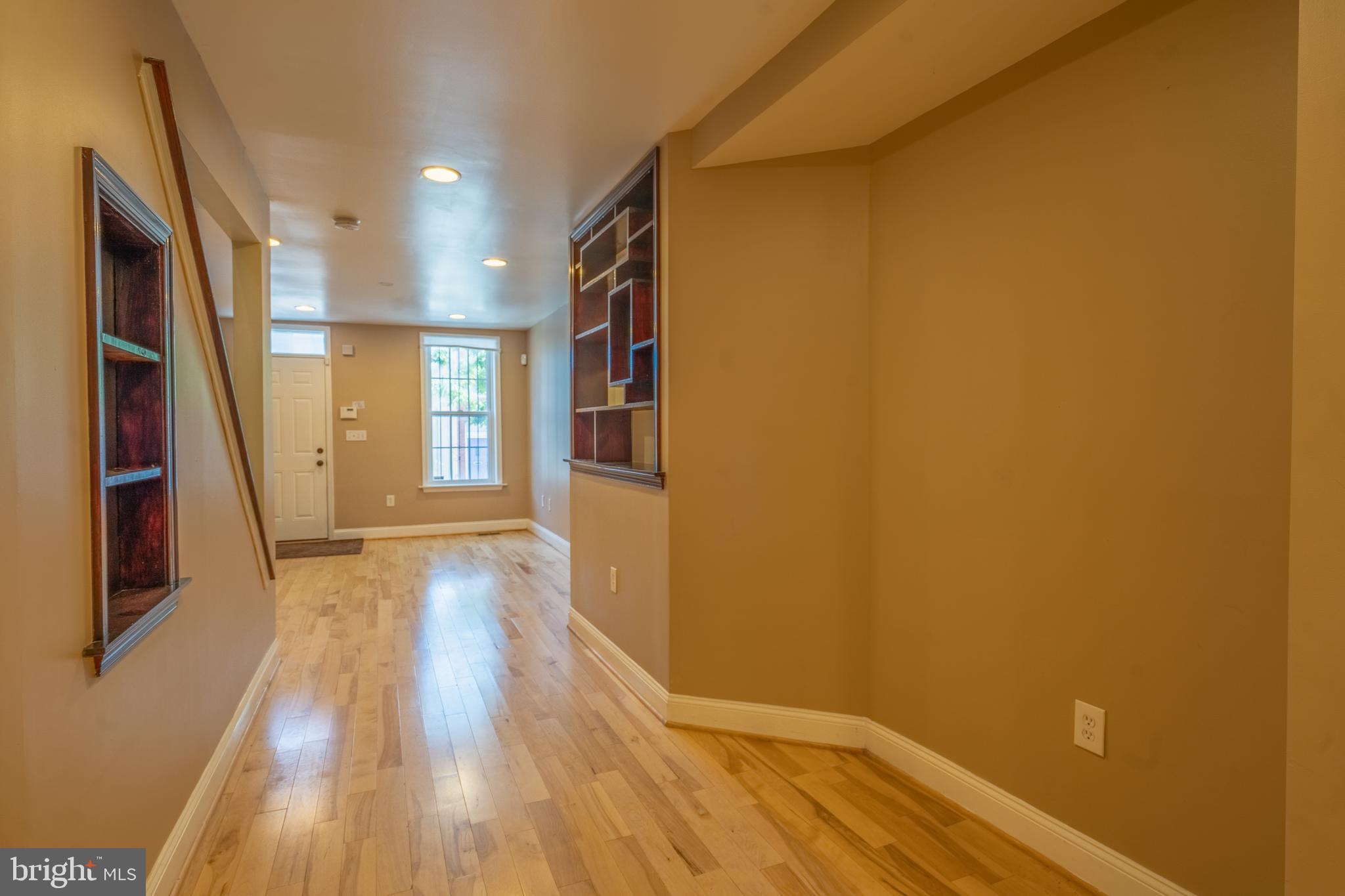 508 Scott Street Baltimore, MD 21230 - Photo 8 of 63 a view of hallway with wooden floor and stairs