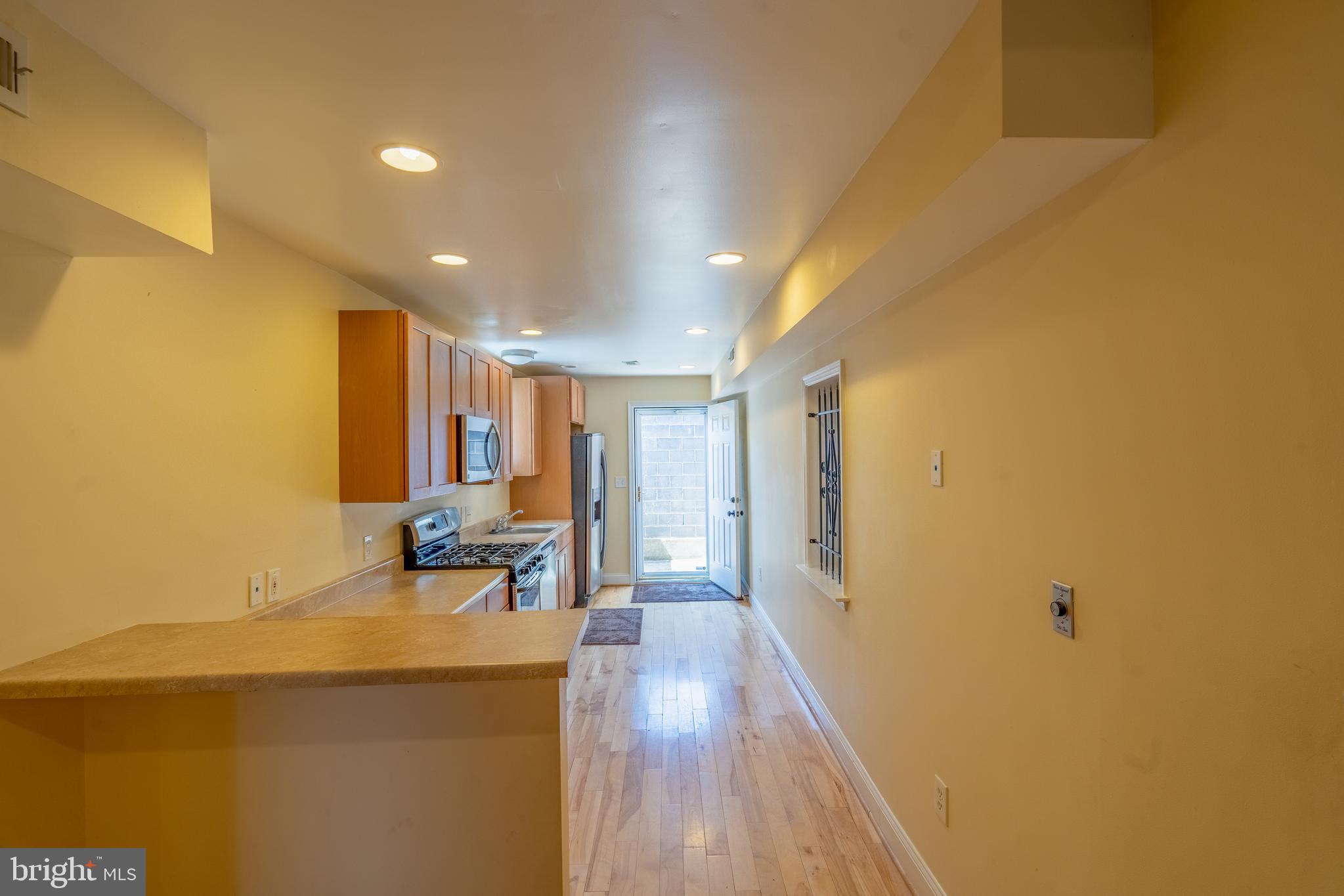 508 Scott Street Baltimore, MD 21230 - Photo 10 of 63 a view of a room with wooden floor and furniture