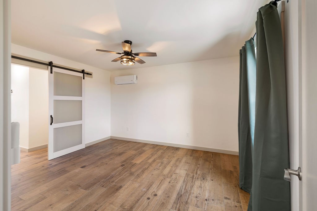198 Beartown Road Loretto, TN 38469 - Photo 23 of 36 wooden floor in an empty room with a window