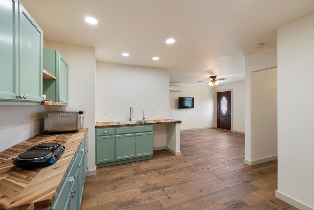 198 Beartown Road Loretto, TN 38469 - Photo 30 of 36 a kitchen with a sink and wooden floor
