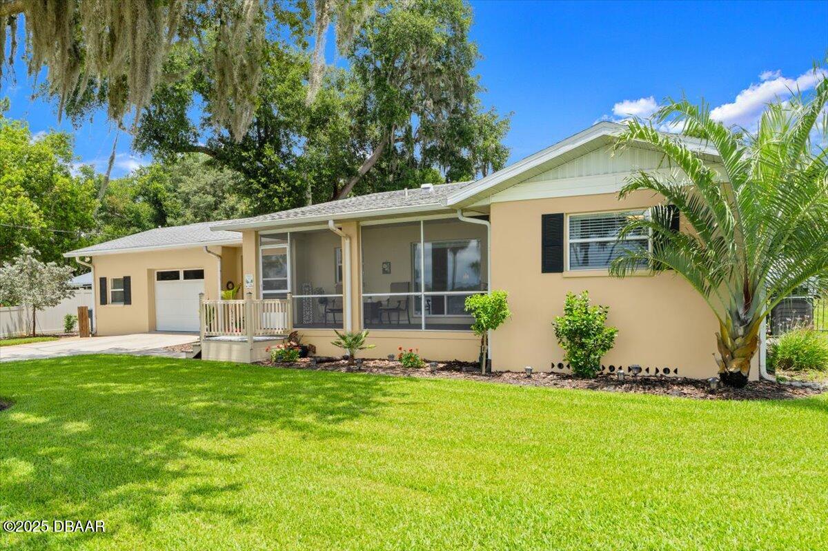 1005 North Kepler Road DeLand, FL 32724 - Photo 12 of 57 a front view of house with yard and green space