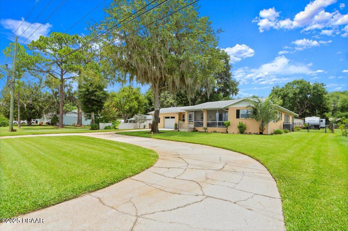 1005 North Kepler Road DeLand, FL 32724 - Photo 13 of 57 a view of a house with a big yard