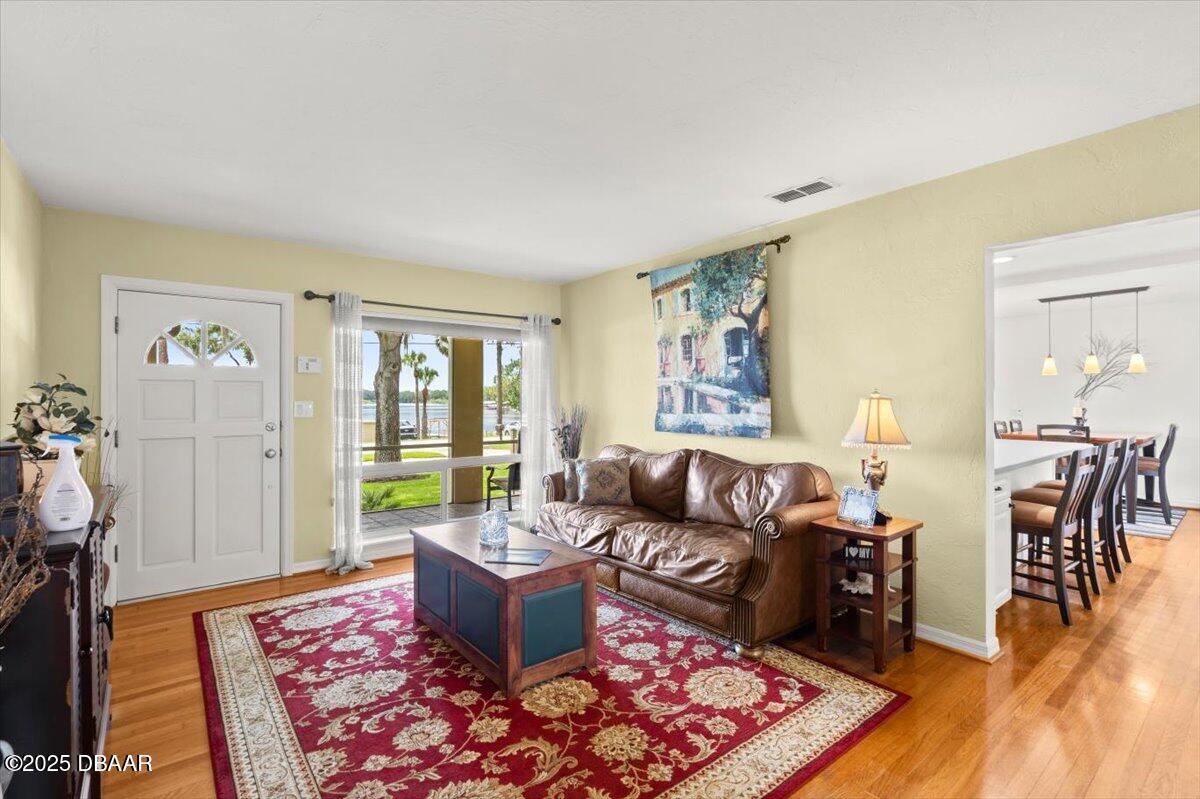 1005 North Kepler Road DeLand, FL 32724 - Photo 17 of 57 a living room with furniture and a rug