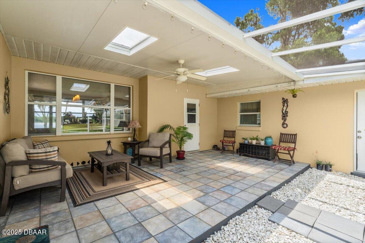1005 North Kepler Road DeLand, FL 32724 - Photo 27 of 57 a living room with furniture and a dining table