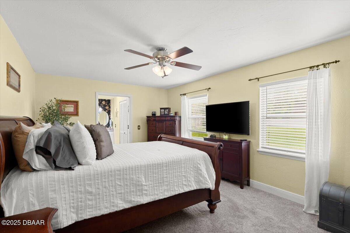 1005 North Kepler Road DeLand, FL 32724 - Photo 29 of 57 a bedroom with a bed and a flat screen tv