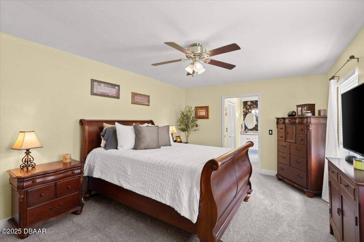 1005 North Kepler Road DeLand, FL 32724 - Photo 30 of 57 a bedroom with a bed and a flat screen tv