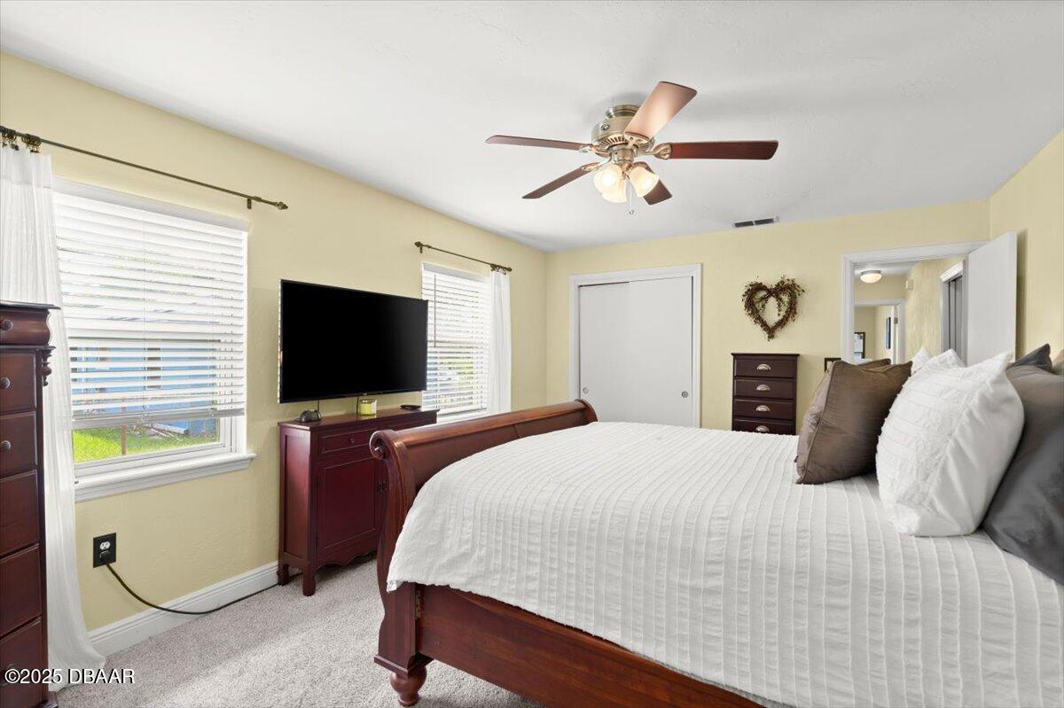1005 North Kepler Road DeLand, FL 32724 - Photo 31 of 57 a bedroom with a bed and a flat screen tv