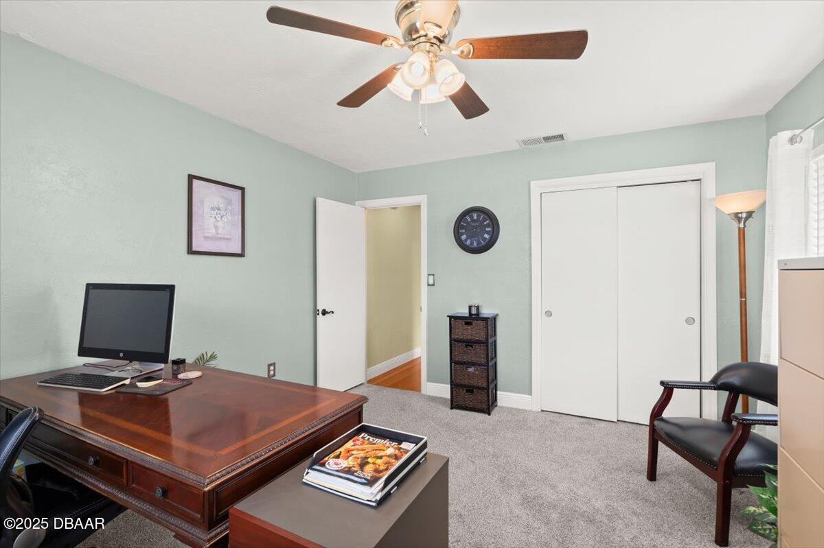 1005 North Kepler Road DeLand, FL 32724 - Photo 36 of 57 a living room with a bed furniture and a window