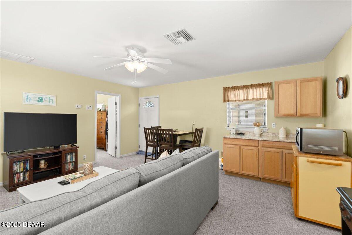 1005 North Kepler Road DeLand, FL 32724 - Photo 39 of 57 a living room with furniture and a flat screen tv