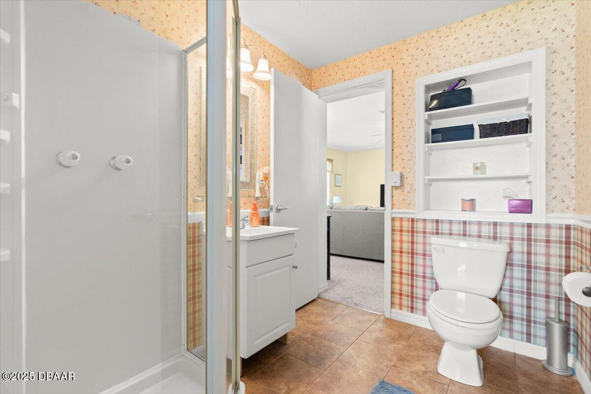 1005 North Kepler Road DeLand, FL 32724 - Photo 45 of 57 a bathroom with a toilet a sink and a shower