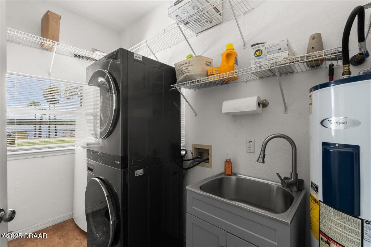 1005 North Kepler Road DeLand, FL 32724 - Photo 46 of 57 a bathroom with a sink and a washing machine
