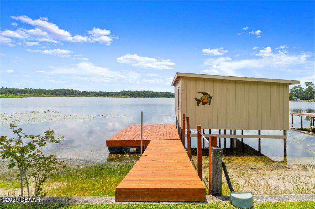1005 North Kepler Road DeLand, FL 32724 - Photo 55 of 57 a view of a swimming pool with an outdoor seating and a yard