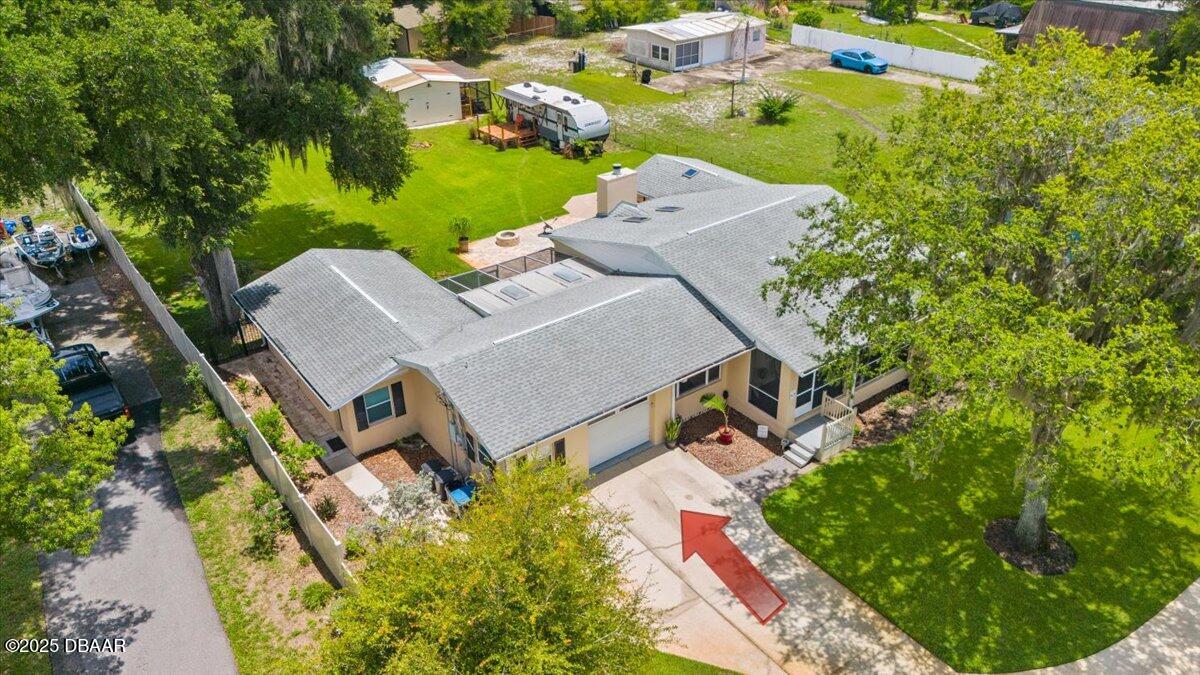 1005 North Kepler Road DeLand, FL 32724 - Photo 8 of 57 an aerial view of a house with a garden