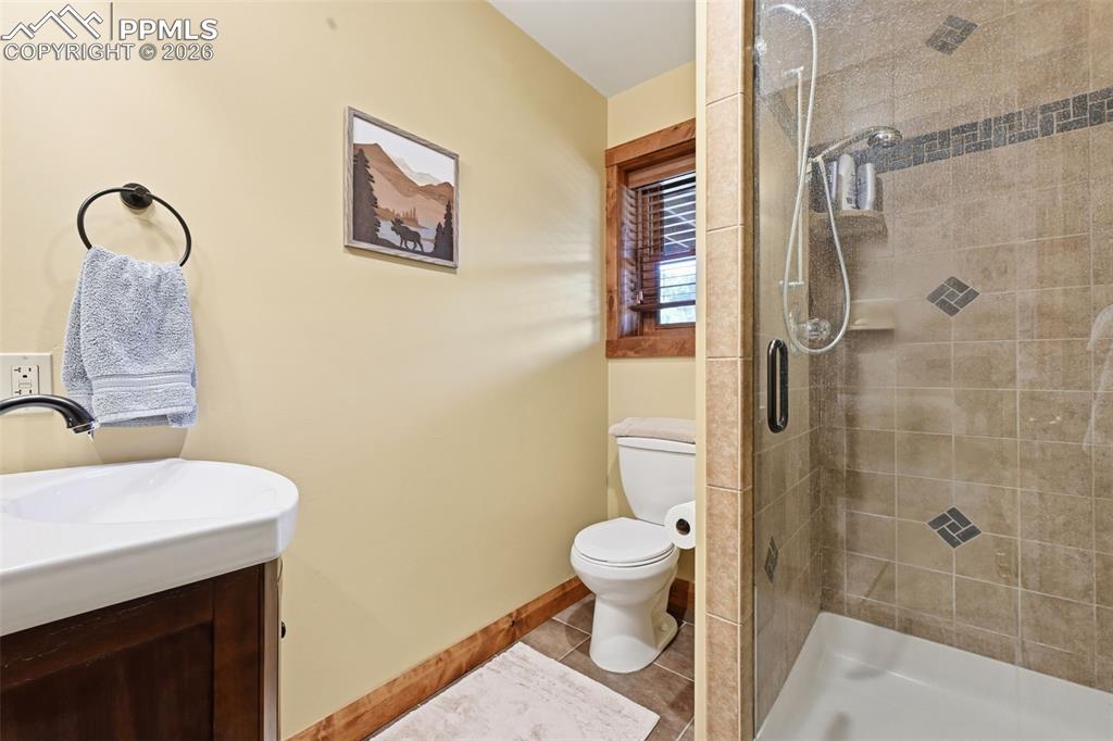 89 Ranch View Road Florissant, CO 80816 - Photo 34 of 50 Basement 3/4 bathroom provides a glass enclosed shower.