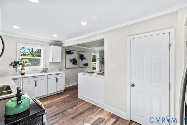 a kitchen with stainless steel appliances granite countertop a refrigerator sink and cabinets