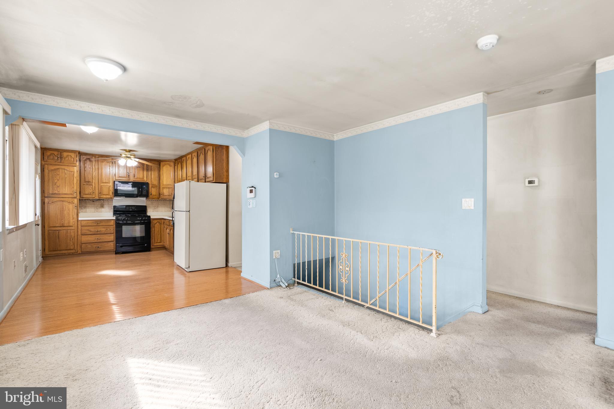 11411 Indigo Drive Beltsville, MD 20705 - Photo 12 of 40 a view of a kitchen with refrigerator and a sink