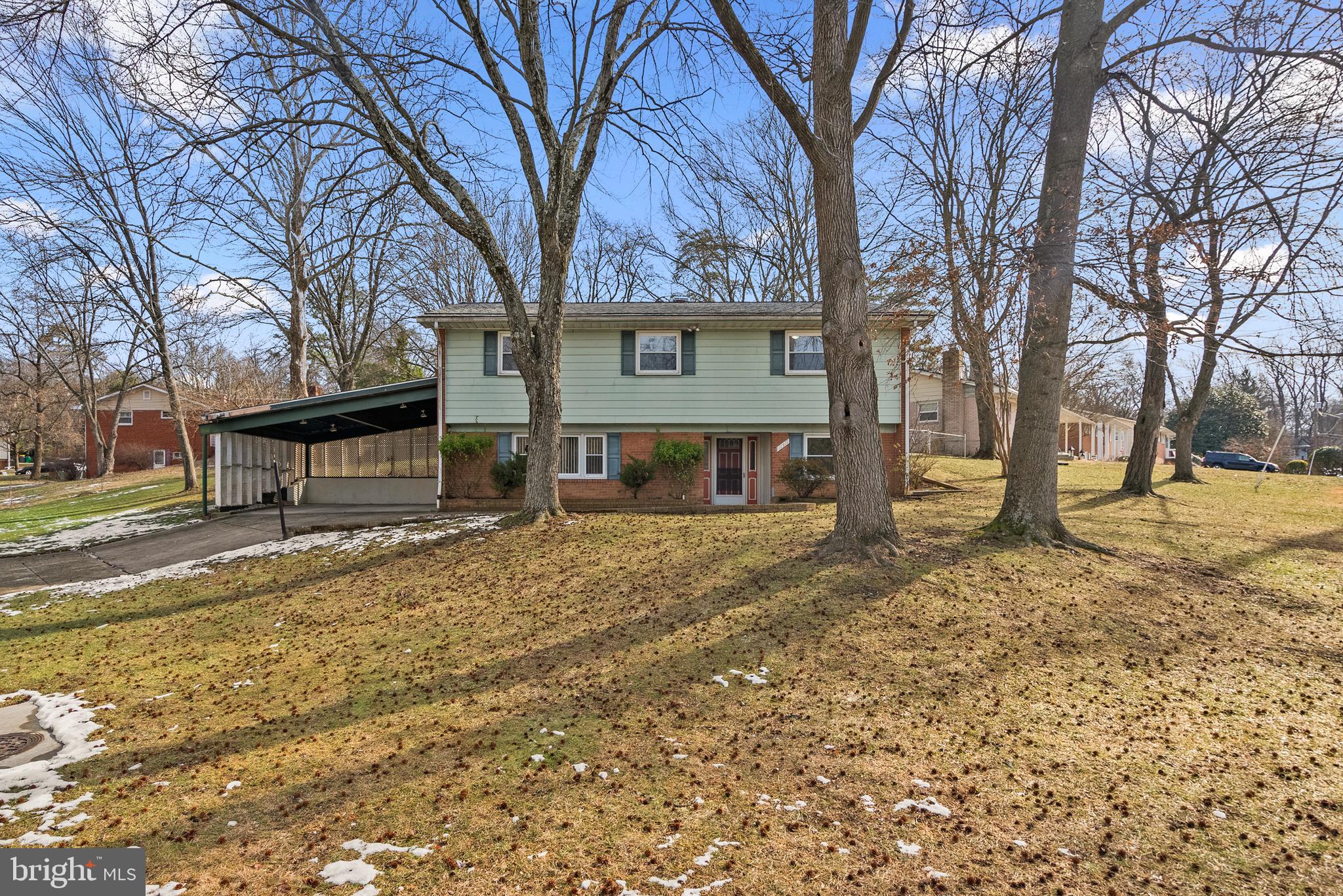 11411 Indigo Drive Beltsville, MD 20705 - Photo 2 of 40 a view of a house with a yard covered in snow