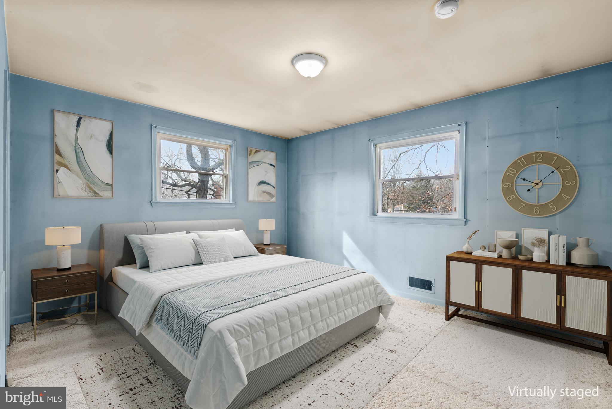 11411 Indigo Drive Beltsville, MD 20705 - Photo 22 of 40 a bedroom with a bed and painting on the wall