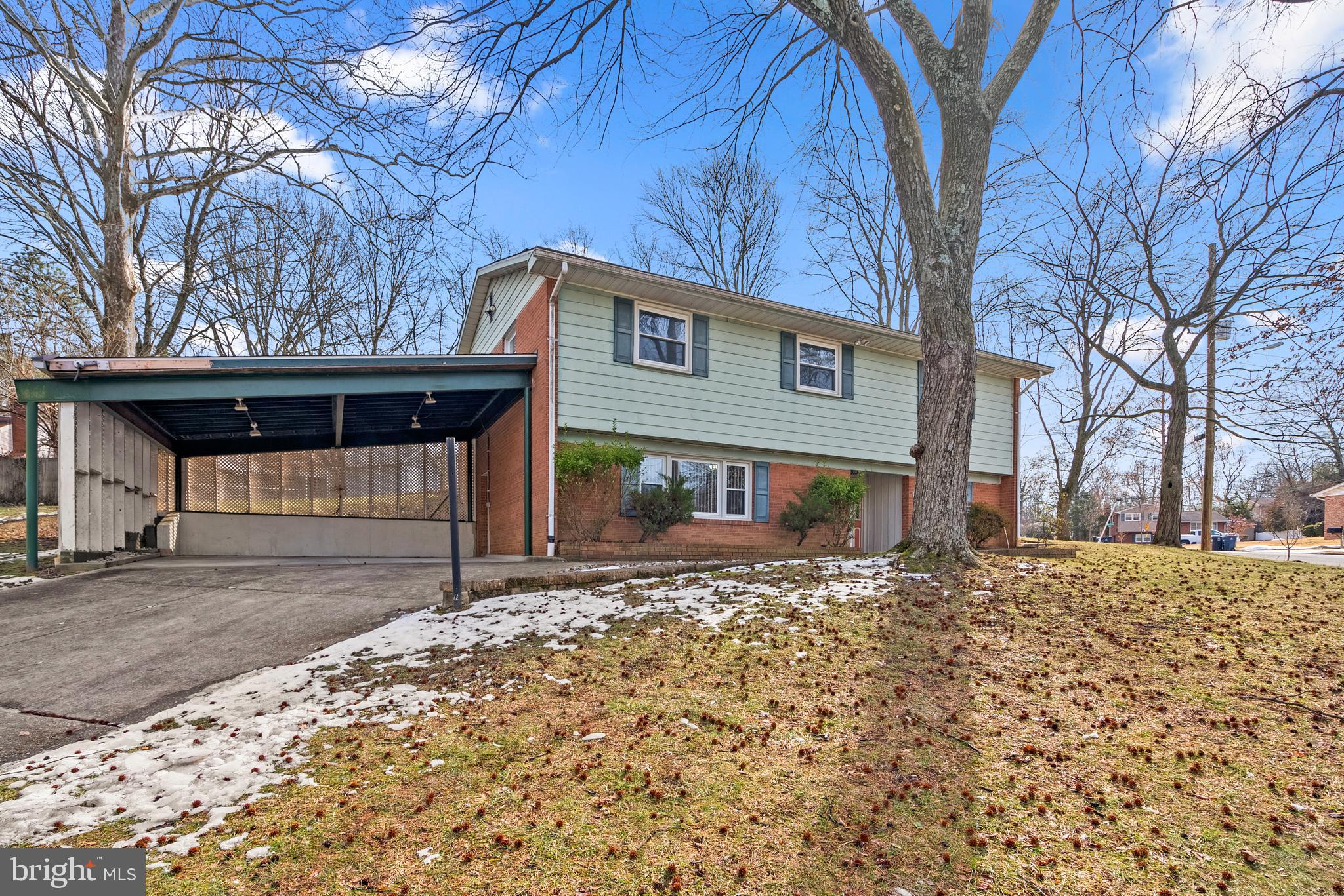 11411 Indigo Drive Beltsville, MD 20705 - Photo 5 of 40 a front view of a house with a yard