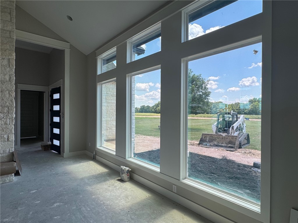 13504 Hudson Farms Road Hearne, TX 77859 - Photo 12 of 32 Entryway with unfinished concrete floors and high