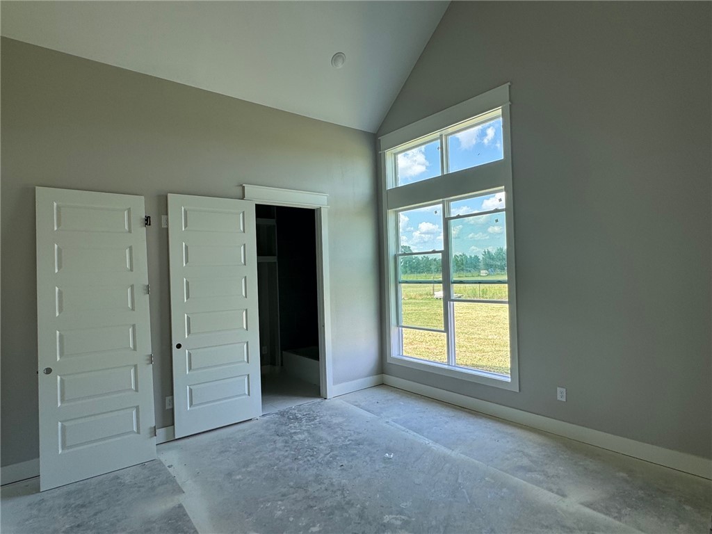 13504 Hudson Farms Road Hearne, TX 77859 - Photo 21 of 32 an empty room with windows and closet
