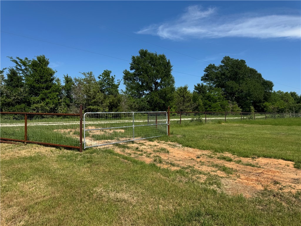 13504 Hudson Farms Road Hearne, TX 77859 - Photo 32 of 32 a view of a golf course with a lake