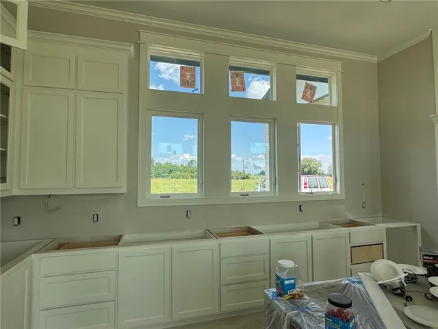 a kitchen with stainless steel appliances granite countertop a refrigerator and a stove
