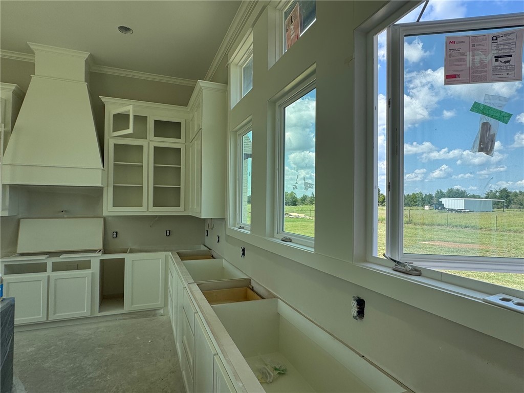 13504 Hudson Farms Road Hearne, TX 77859 - Photo 7 of 32 a bathroom with a tub sink and window