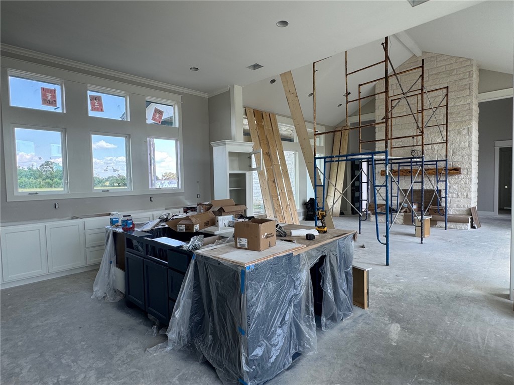 13504 Hudson Farms Road Hearne, TX 77859 - Photo 10 of 32 Kitchen featuring high vaulted ceiling, white cabi