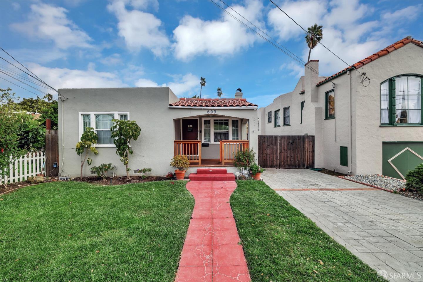 a view of a house with a swimming pool and a yard