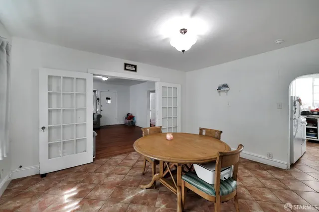 a view of a room that has a table and chairs in it