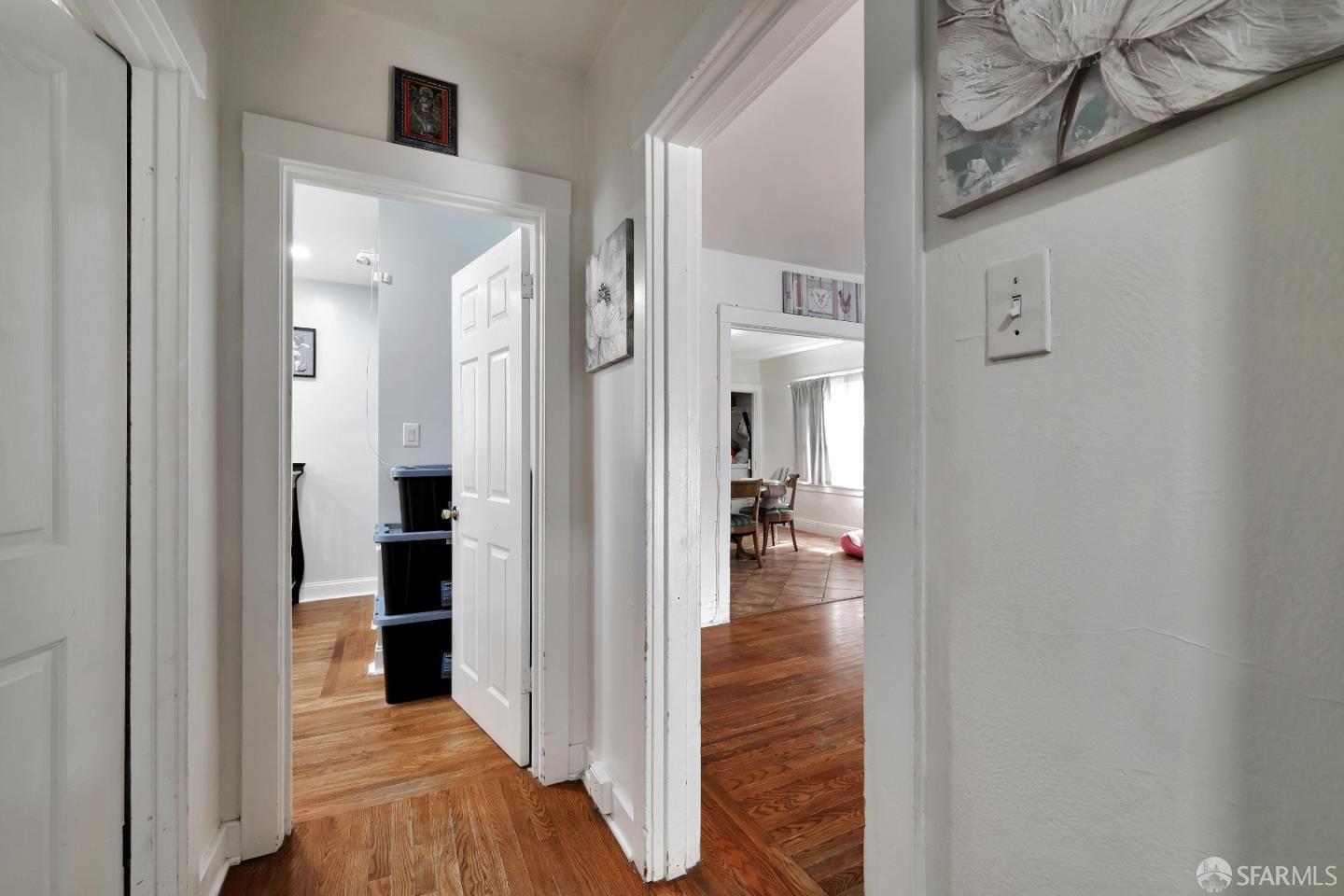 609 South Delaware Street San Mateo, CA 94402 - Photo 15 of 22 a view of a hallway with dining room and wooden floor