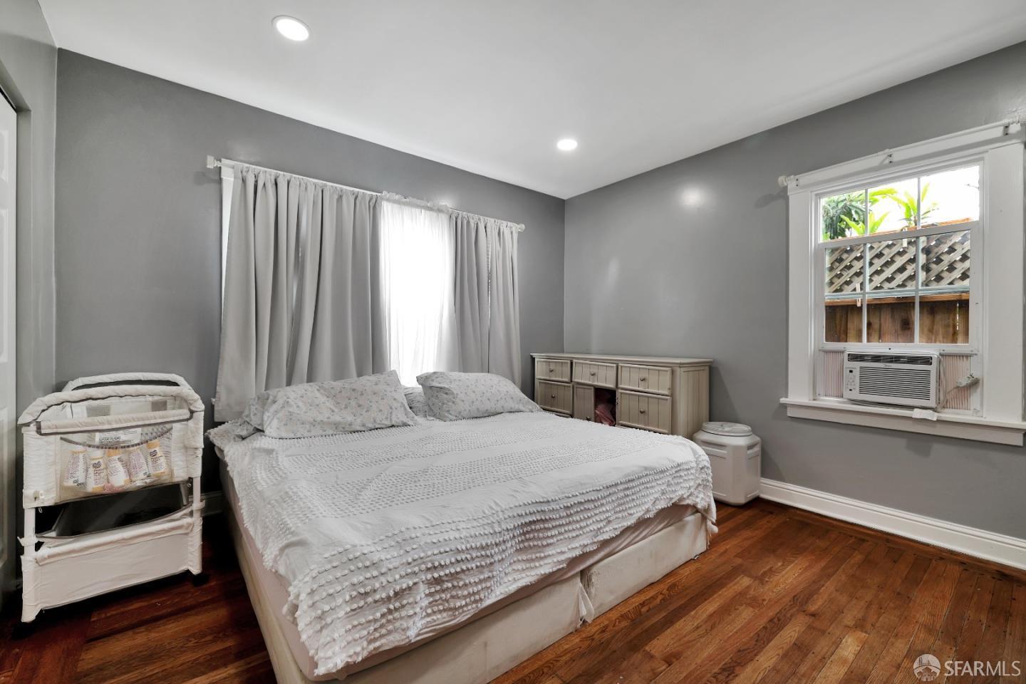 609 South Delaware Street San Mateo, CA 94402 - Photo 16 of 22 a bedroom with a bed and a window