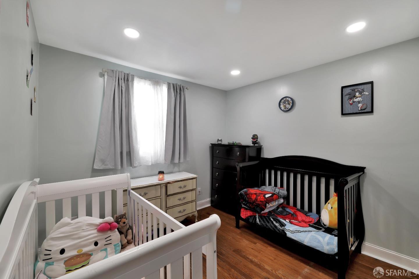 609 South Delaware Street San Mateo, CA 94402 - Photo 18 of 22 a bedroom with furniture with a baby crib