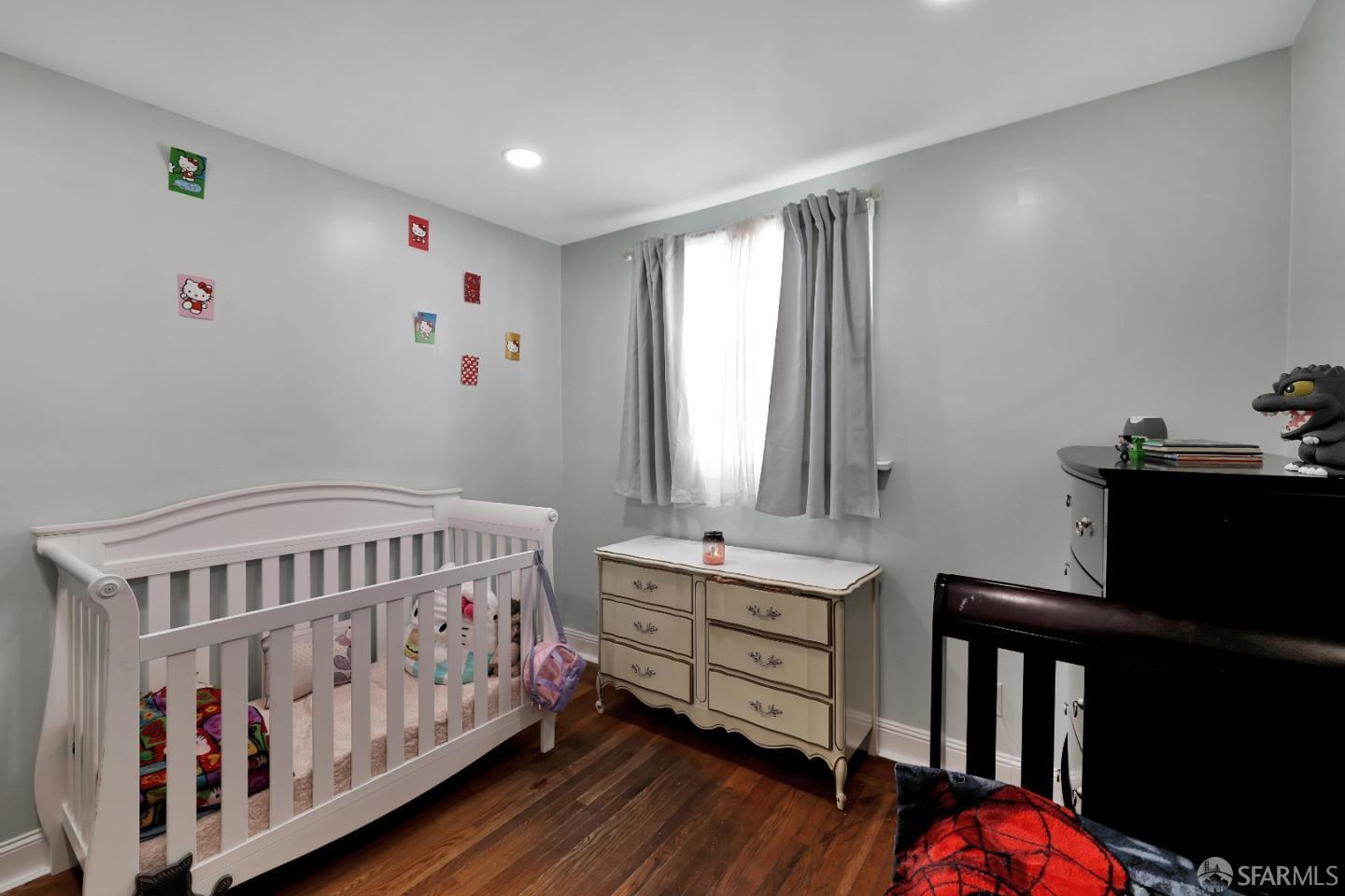 609 South Delaware Street San Mateo, CA 94402 - Photo 19 of 22 a bedroom with furniture and a window