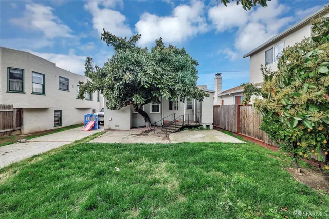 a view of a backyard with a garden and plants
