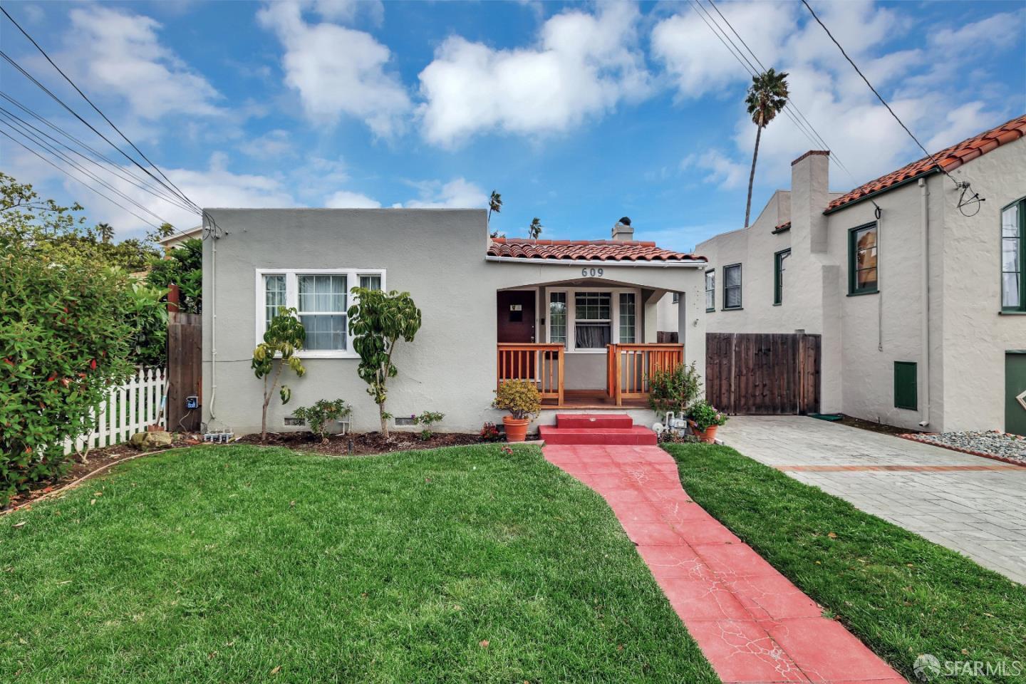 609 South Delaware Street San Mateo, CA 94402 - Photo 3 of 22 a front view of a house with a big yard and potted plants