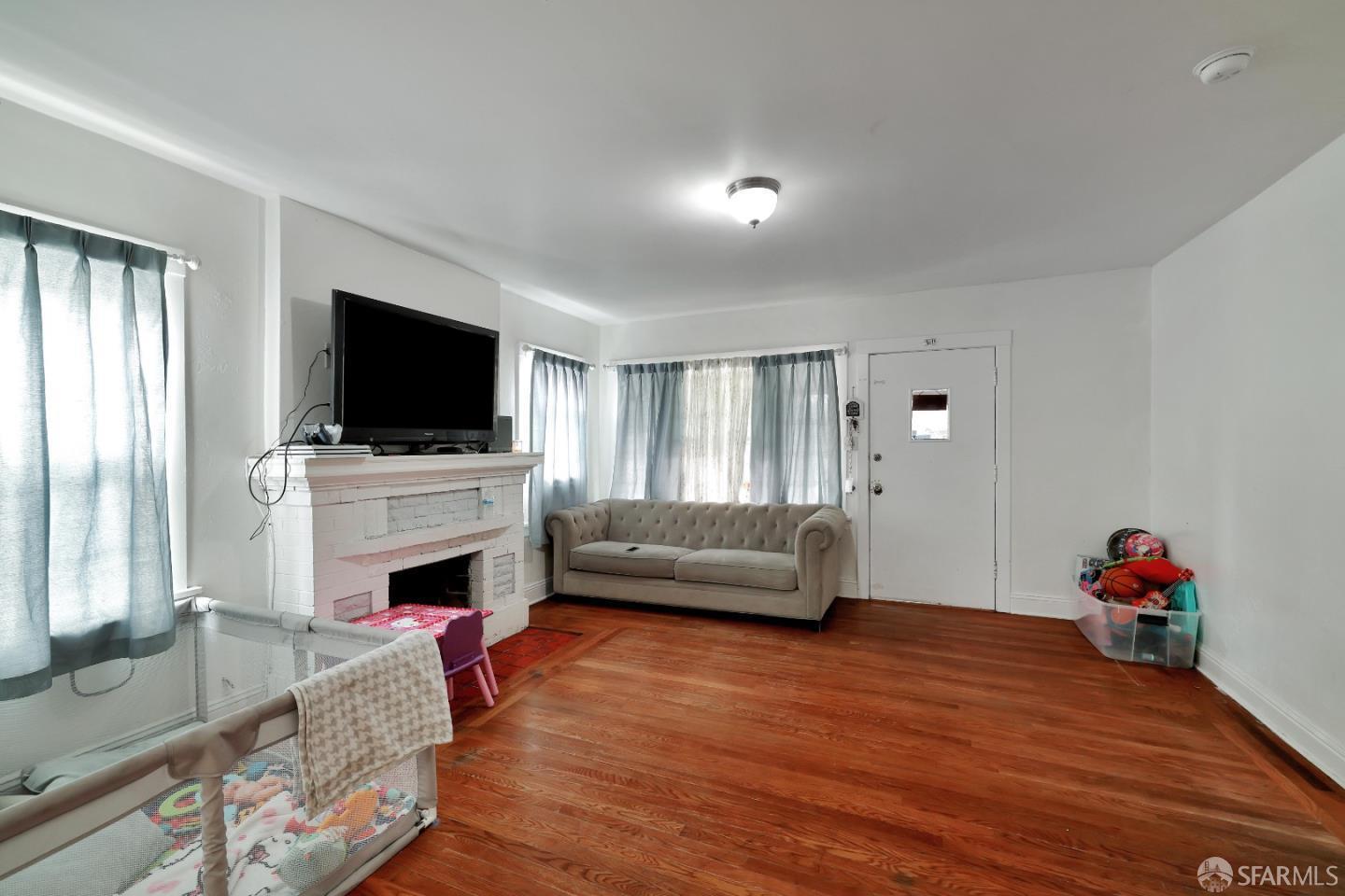609 South Delaware Street San Mateo, CA 94402 - Photo 7 of 22 a living room with furniture and a flat screen tv