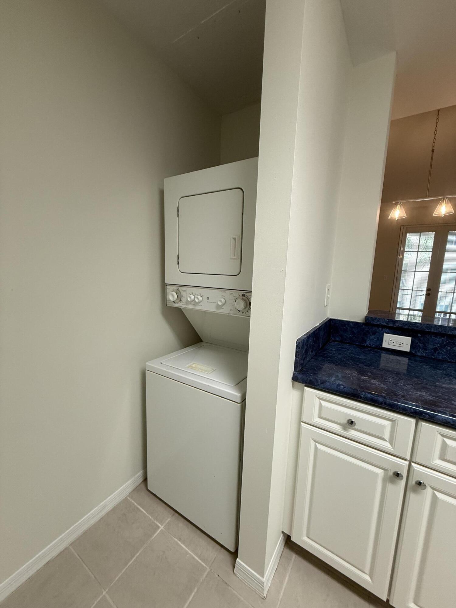 1200 Town Center Drive, Unit 206 Jupiter, FL 33458 - Photo 16 of 24 a utility room with dryer and washer