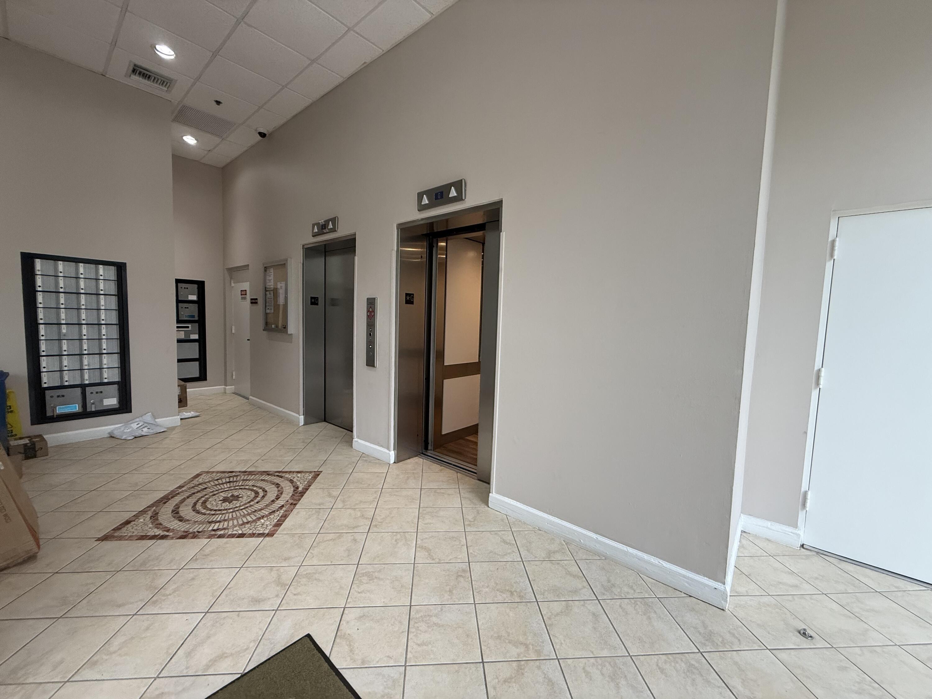 1200 Town Center Drive, Unit 206 Jupiter, FL 33458 - Photo 24 of 24 a view of a hallway with some storage area