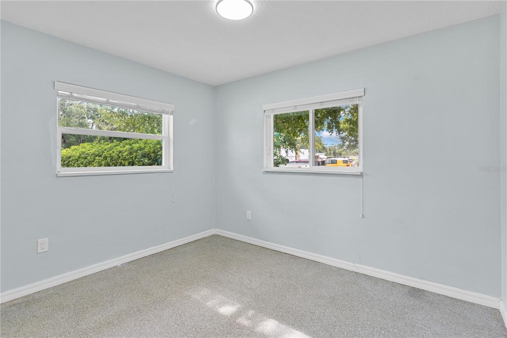 11987 Maple Street, Unit 1 Dunnellon, FL 34432 - Photo 13 of 25 an empty room with a window