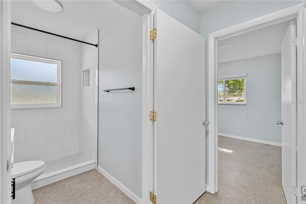 11987 Maple Street, Unit 1 Dunnellon, FL 34432 - Photo 17 of 25 a bathroom with a shower and toilet