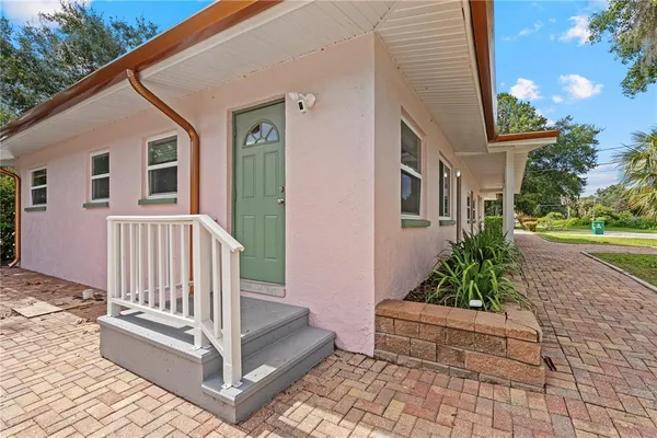 a view of a house with a white walls
