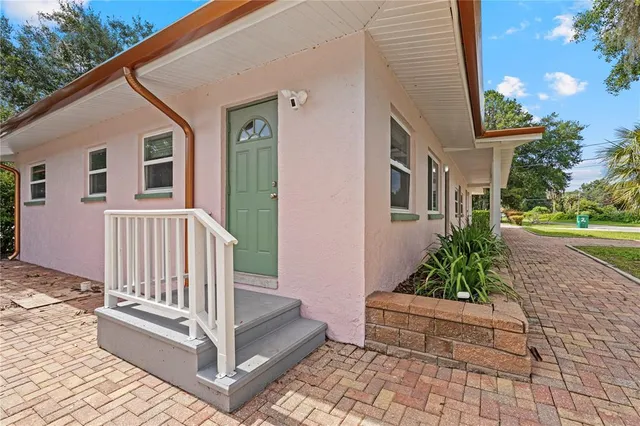 a view of a house with a white walls