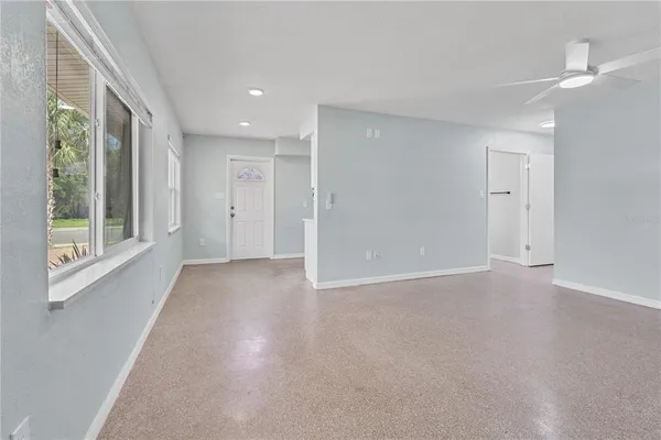 a view of an empty room with a window