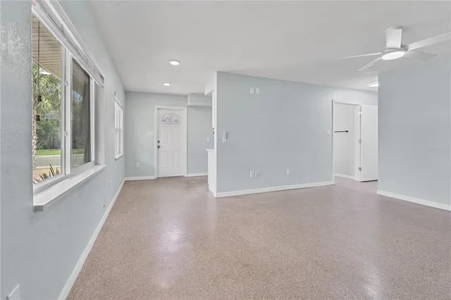 a view of an empty room with a window